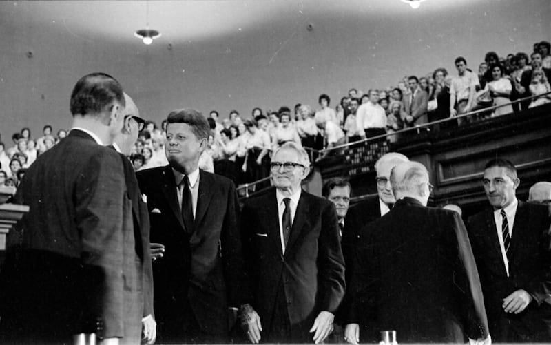 President John F. Kennedy talks to Cal Rollins, with President David O. McKay at right, after speaking in the Tabernacle in Salt Lake City in 1960.