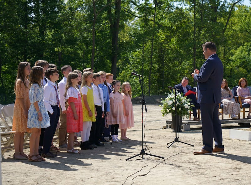 Children singing.