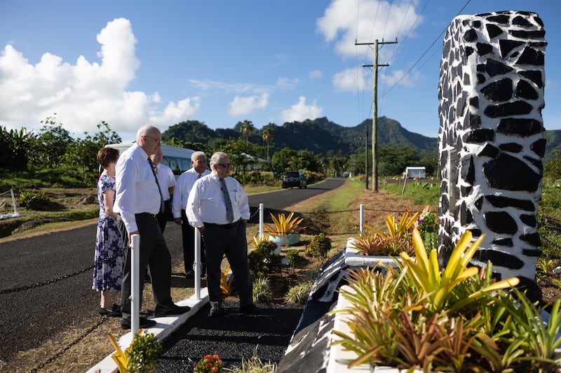 Elder Ronald A. Rasband of the Quorum of the Twelve Apostles and other Church leaders stop by a monument near Sauniatu Primary School in Samoa on Friday, March 22, 2024.