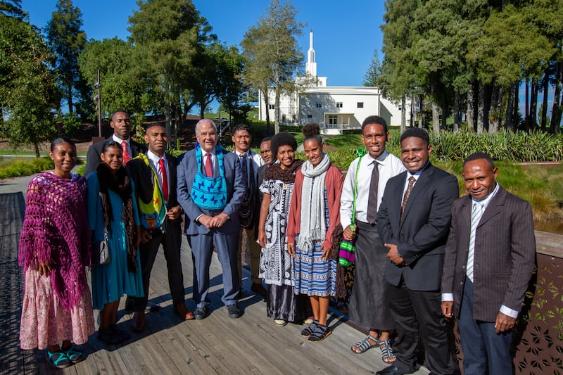 Elder Ronald A. Rasband of the Quorum of the Twelve Apostles meets with 11 prospective missionaries in front of the Hamilton New Zealand Temple on Monday, March 18, 2024.