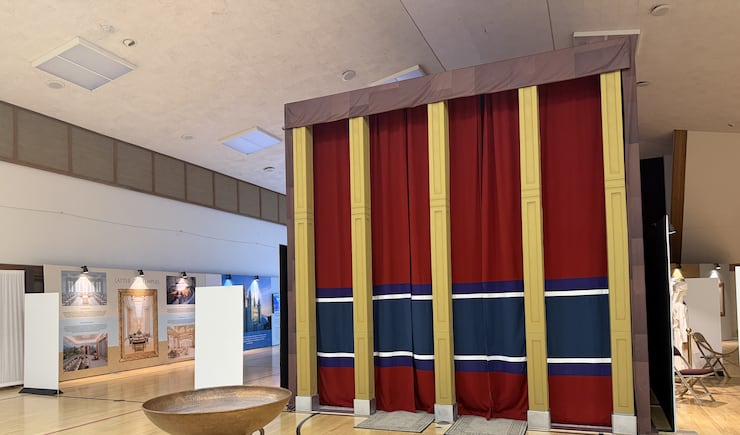 In the "courtyard" of the tabernacle replica, visitors can see a replica of the "bronze laver" filled with water and a horn of oil, Farmington Utah North Stake center, June 18, 2026.
