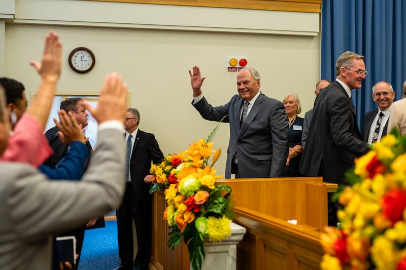 Elder Ronald A. Rasband of the Quorum of the Twelve Apostles waves to missionaries during a devotional in Brisbane, Australia, on March 16, 2024.