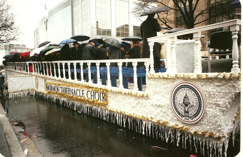 The Tabernacle Choir at Temple Square members carry umbrellas on a float for a parade that was part of the 2001 inauguration for President George W. Bush.