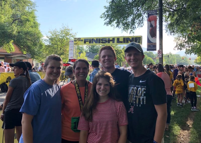 Sydney Walker, center left, with her family after finishing the Deseret News Marathon on July 24, 2018.