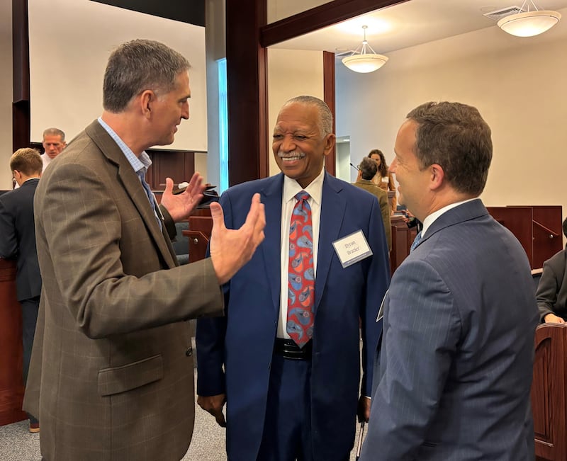 Three men converse at an interfaith gathering hosted by the Church's Chicago-area Communications Council on Oct. 14, 2026.